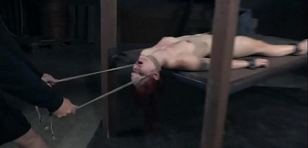  Suspended redhead clit punished with electro